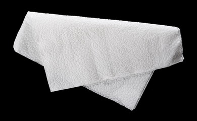 Paper napkin isolated on black background, top view