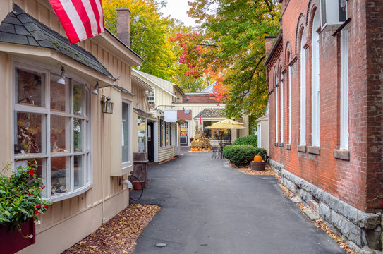 Deserted Alley Lined with Traditional Shops Decorated for Halloween