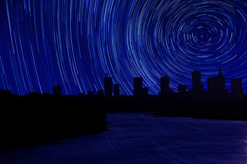 Photomontage panorama of Warsaw with flowing river and stars track © Pawel Horazy
