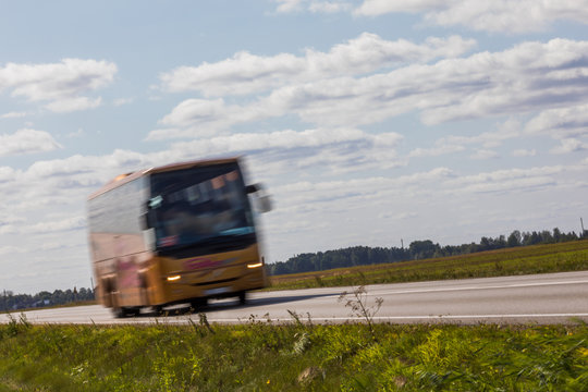 Bus on the road with motion blur. Blurred image background. Colorful wallpaper with copy space