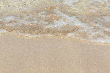 Soft wave of the sea on the sandy beach