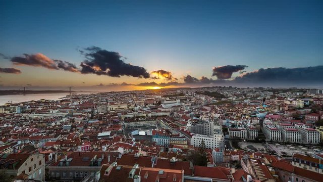 Amazing aerial sunset timelapse of sun rays over the Lisbon cityscape (Baixa district). Portugal. April, 2017