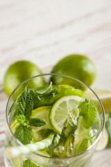 Mojito cocktail on white wood background