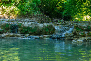 the landscape in the valley of a mountain river