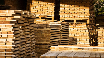The boards in the sawmill are stacked