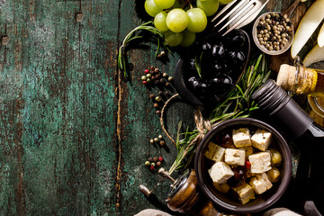 Obraz na płótnie Canvas Tasty Italian Greek Mediterranean Food Ingredients Top View on Green Old Rustic Table Above