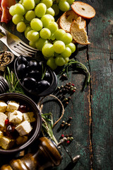 Tasty Italian Greek Mediterranean Food Ingredients Top View on Green Old Rustic Table Above
