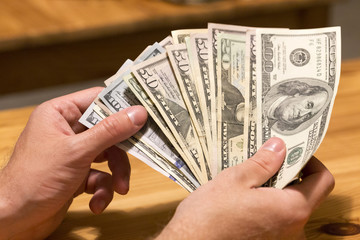 US Dollar Bills in the Hand