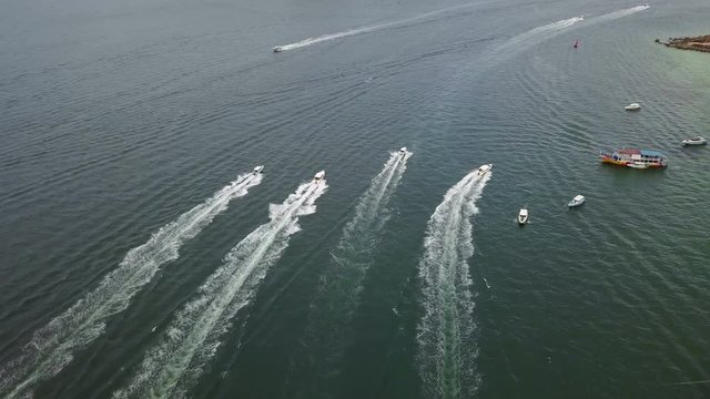 4K Aerial view of speed boat traffic to the island