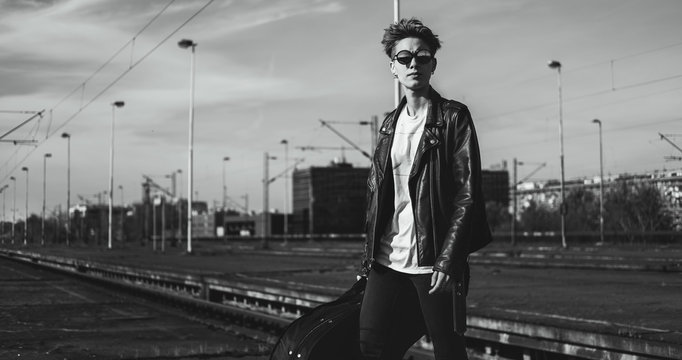 Portrait of female punk/rocker in city.