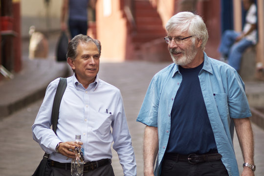 Realtor and client talking while walking to see a house