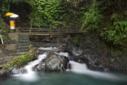 Waterfall and bridge at Gitgit waterfall.