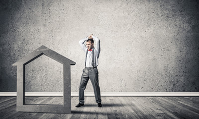 Obraz premium Stone home silhouette in empty room as symbol for real estate in