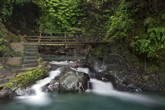 Waterfall and bridge at Gitgit waterfall.