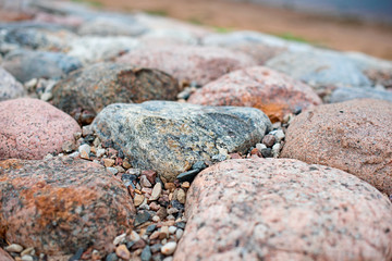 Colored stones on the coast, soft focus
