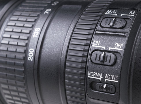 Camera lens with lense reflections. Lens for SLR Single Lens Reflex Camera. Modern digital SLR camera. Detailed photo of a classic wide aperture portrait lens.