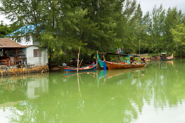 Small village house at the river in Thailand