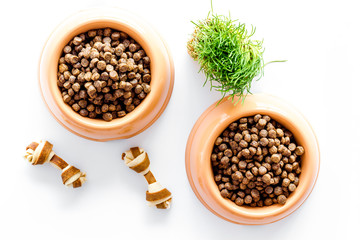 dry pet - dog food in bowl on white background top view