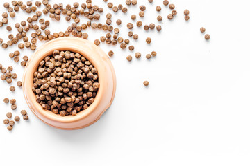large bowl of pet - dog food spilling on white background top view mockup