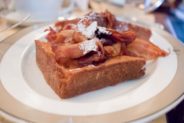 French toast with crispy bacon breakfast brunch dish.