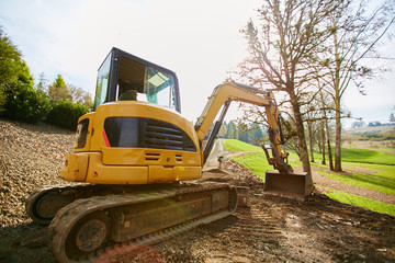 large tractor digger on dirt