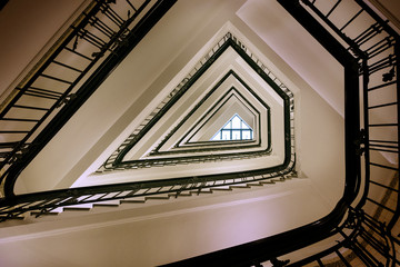 Old triangular spiral stairway case from below