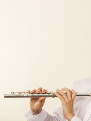 Flute music instrument in hands of flutist musician
