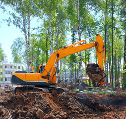 Industrial excavator, bulldozer or heavy machinery working on construction site