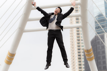Fototapeta premium CEO businessman jumping celebrating after him work success