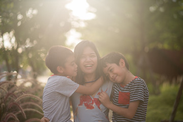 Single mom walking with son together with happy face