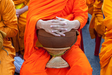 Buddhist monk's bowl in hands. - obrazy, fototapety, plakaty