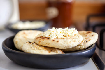 Traditional Colombian white corn arepa with cheese