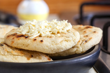 Traditional Colombian white corn arepa with cheese