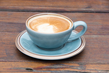 hot latte coffee on wooden table.