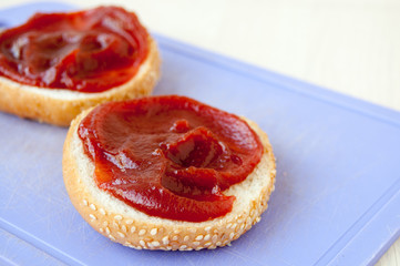 Two buns with sesame and jam for breakfast