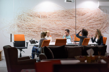 Startup Business Team At A Meeting at modern night office building