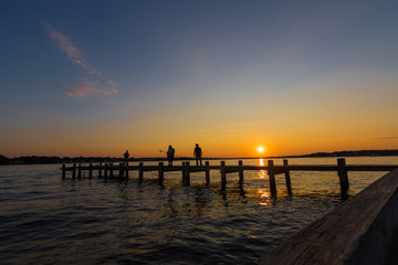 Fototapeta na wymiar Jersey Shore sunset with fisherman 