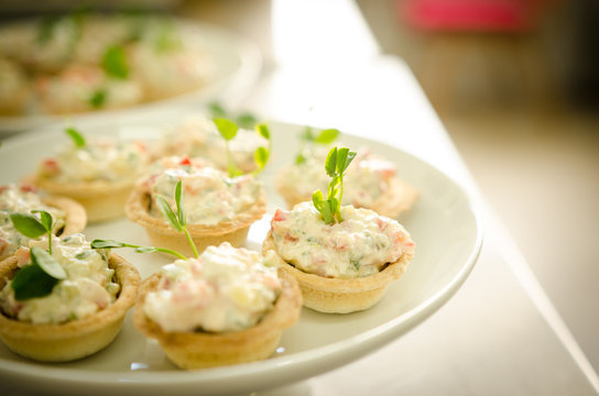 Tartlets with cream cheese salad. Catering services