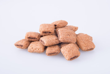 cookie or biscuits filled with chocolate cream on a background.