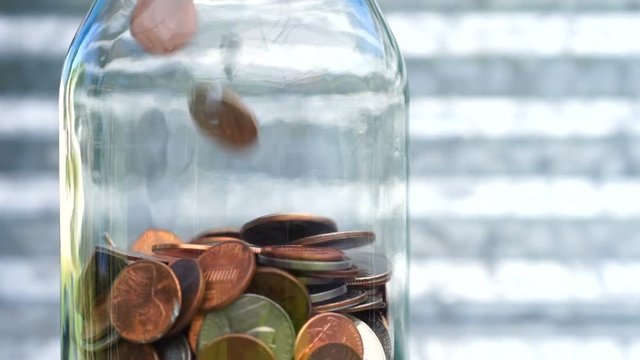 American Dollar Currency Coins in Jar Pennies Nickels Quarters Dimes