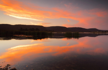 Fototapeta na wymiar Sunset colour reflections in the lake Penrith Australia
