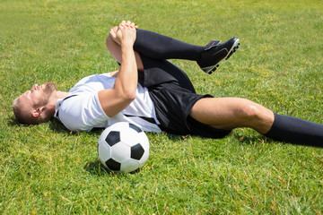 Male Soccer Player Suffering From Knee Injury