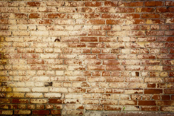 Old colored brick wall texture grunge background