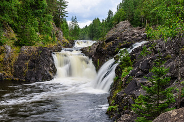 Naklejka na ściany i meble The waterfall Kivach on the Suna River (Long exposure). Karelia, Russia.