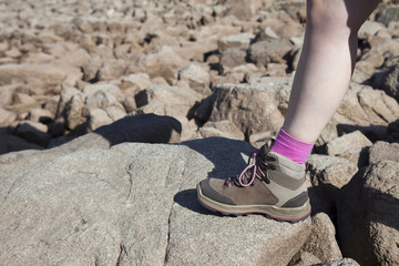 mountain shoe of woman hiking in rocks