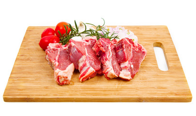 wood table with raw lamb meat 
