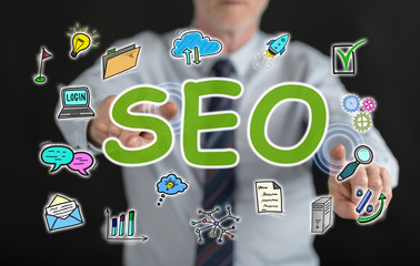 Man touching a seo concept on a touch screen