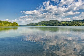 Lake Fuschlsee near Fuschl am See under blue sky with white clouds in summer, Salzburg state, Salzkammergut, Austria, Europe