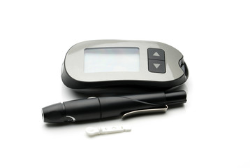Medical equipment for measuring the level of blood glucose with lancing pen device on white background with copy space