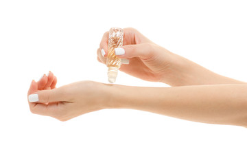 Female hands with perfumed roller perfume